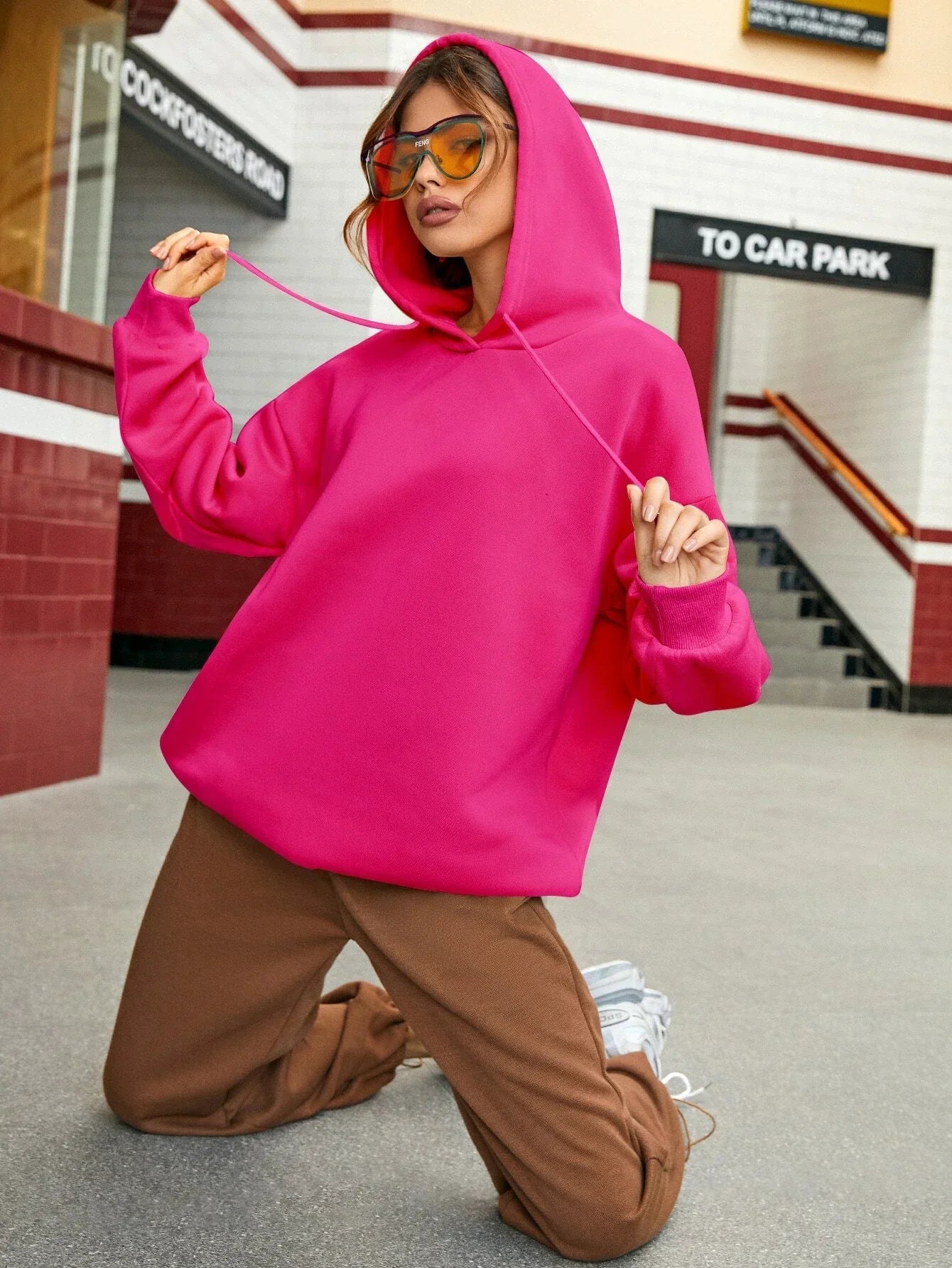 Sweater with a casual text logo design, monochrome style and hood for women