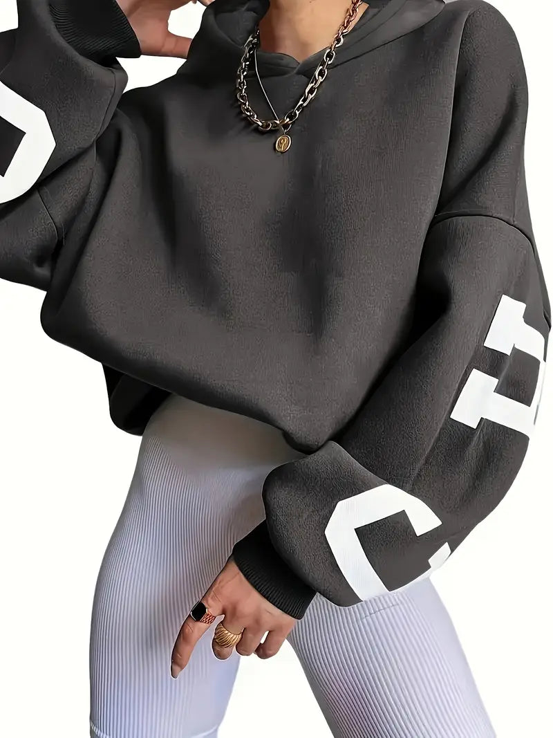 Sweater in oversized long-sleeved design with text logo on the sleeve for women
