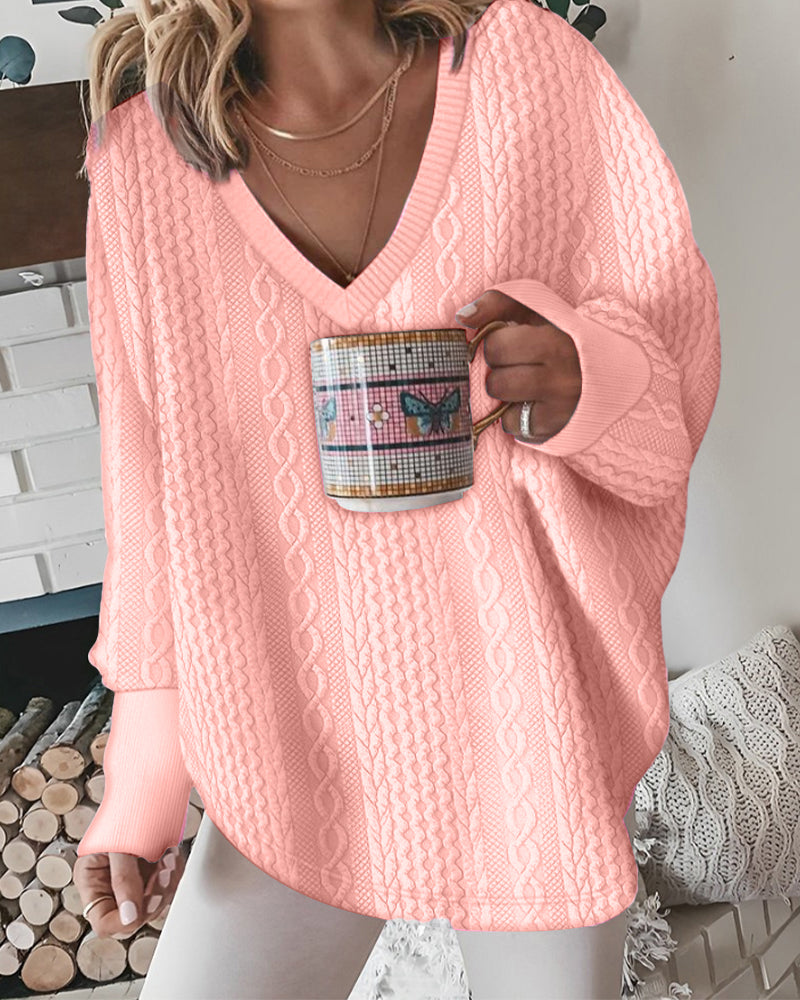 Sweater with long-sleeved design, crossed embroidery and V-neckline