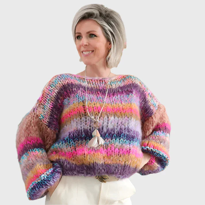 Winter sweater made of rope in a colorful pattern with wooden buttons for women