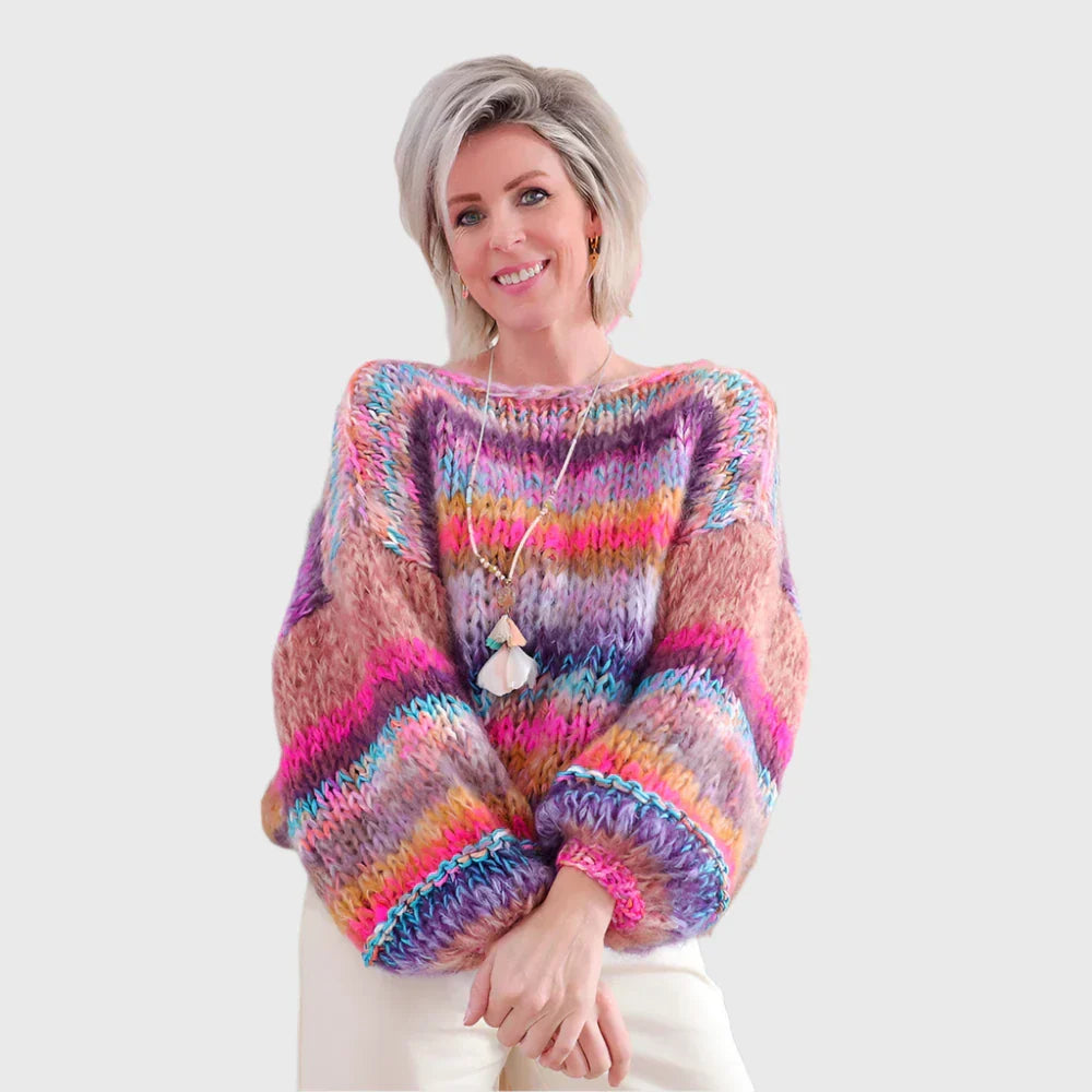 Winter sweater made of rope in a colorful pattern with wooden buttons for women