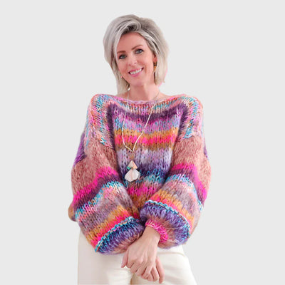 Winter sweater made of rope in a colorful pattern with wooden buttons for women