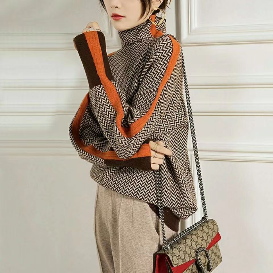 Rolling collar sweater with a geometric knitting pattern