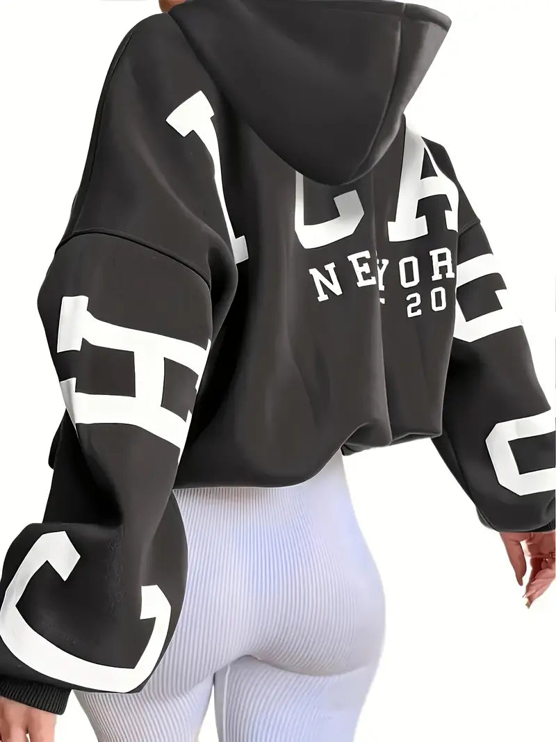 Sweater in oversized long-sleeved design with text logo on the sleeve for women