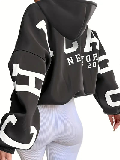 Sweater in oversized long-sleeved design with text logo on the sleeve for women