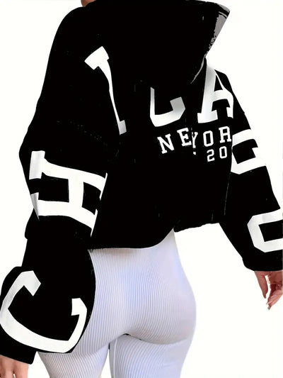 Sweater in oversized long-sleeved design with text logo on the sleeve for women