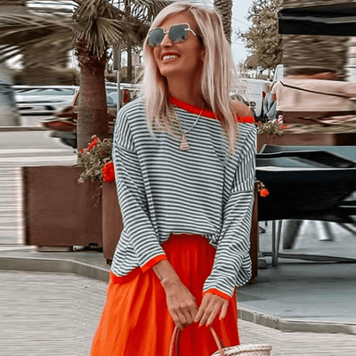 Sweaters in blue with orange -colored edge and striped pattern